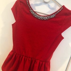 Red peplum top with crystal neckline